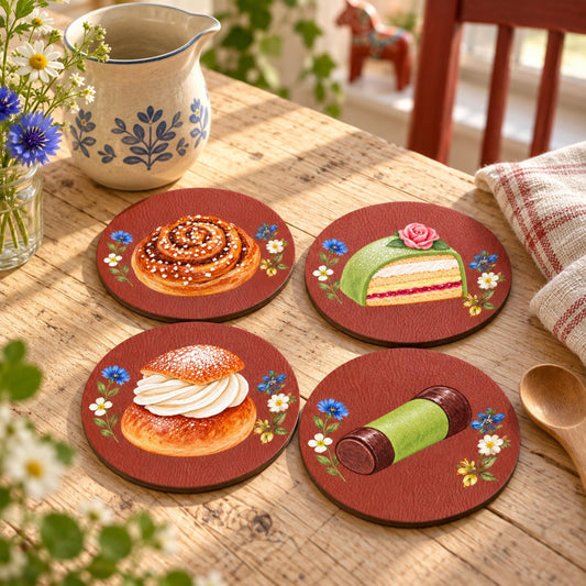 Set of four Falun Red Swedish fika coasters with kanelbulle, semla, prinsesstårta and dammsugare illustrations by Hej Hemma