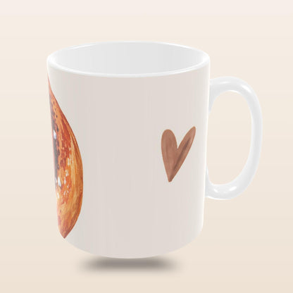     Kanelbulle Mug with Swedish cinnamon bun in a cosy fika setting